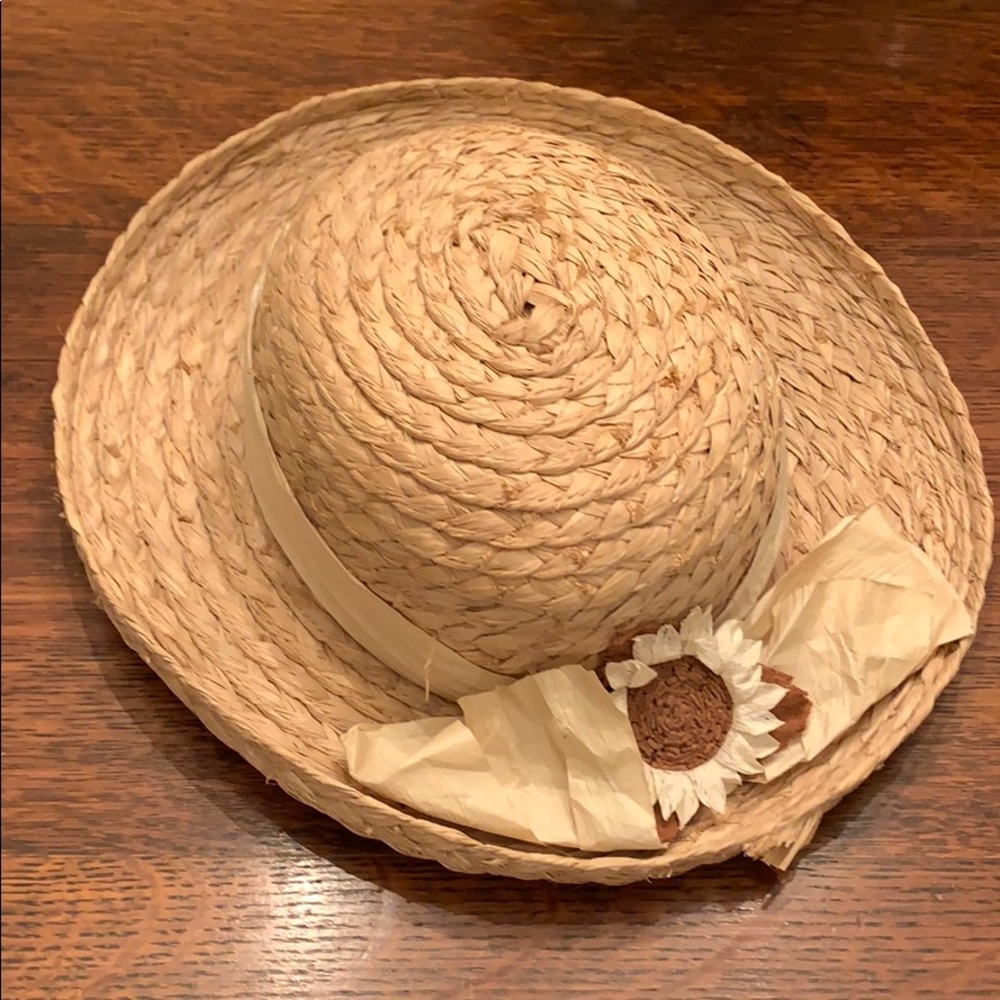 Straw hat with paper bow and flower